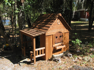 cedar playhouse turned into a chicken coop