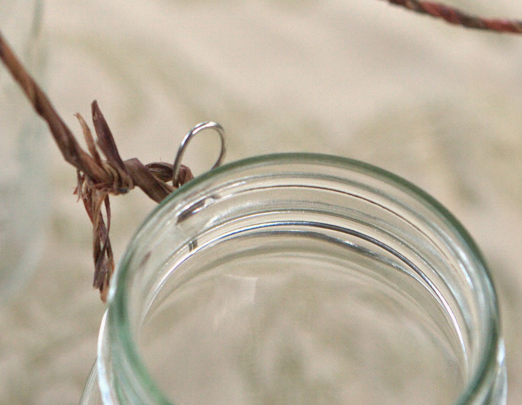 Add twine to the top of the mason jar outdoor light