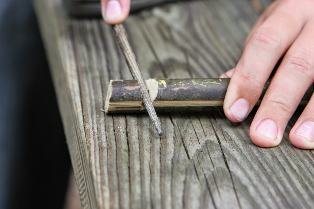 filing the air hole for a wooden bamboo whistle