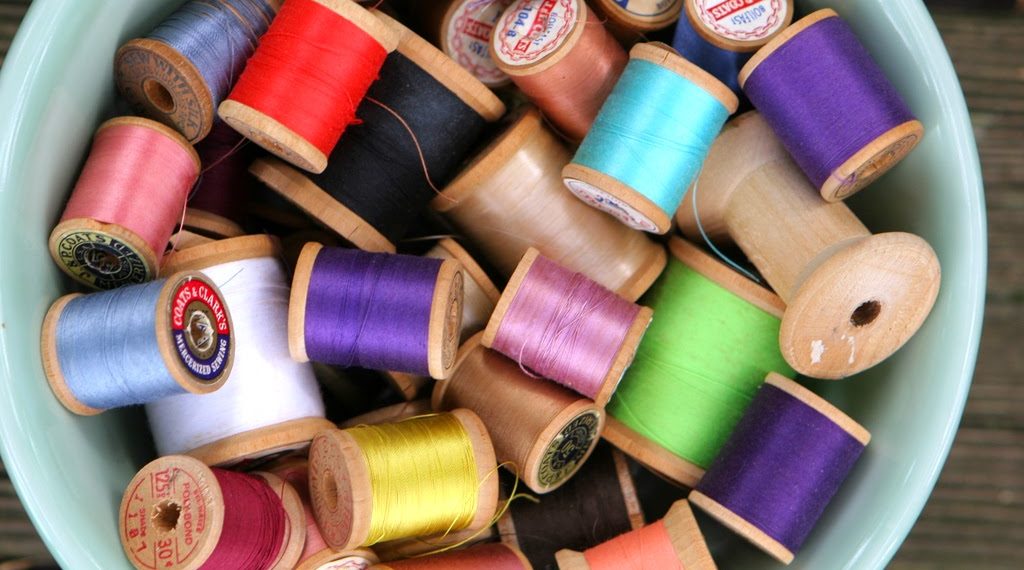 Wooden outlet thread spools