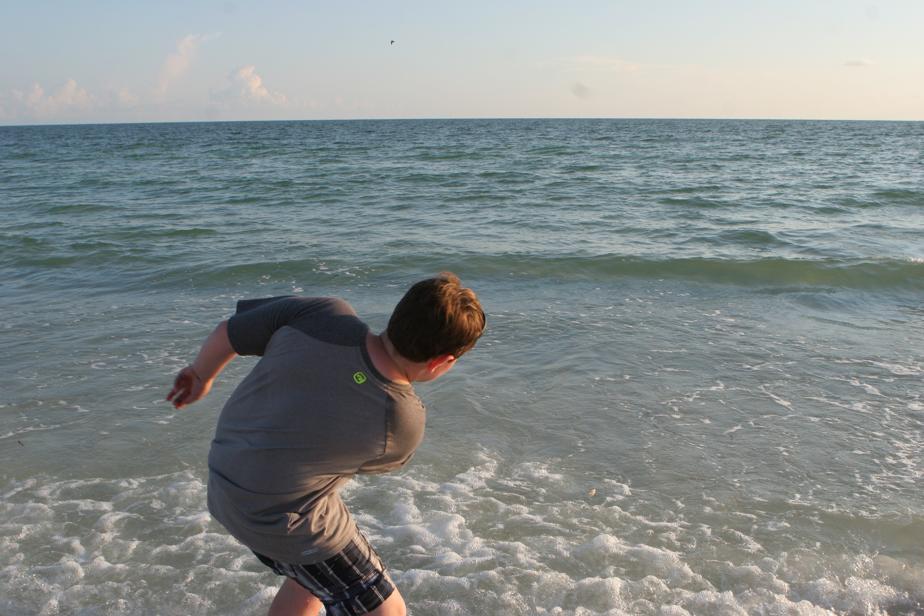 grant skipping rocks on honeymoon island beach